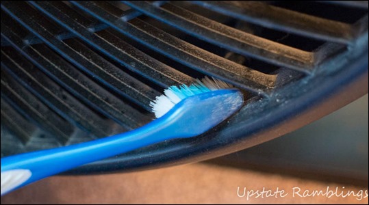 Cleaning a fan with a toothbrush
