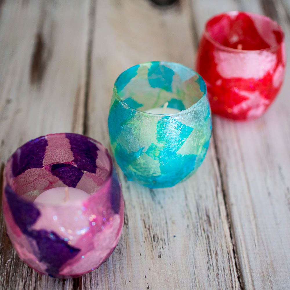 Stained Glass Votive Candle Holders - an easy to make craft using glass candle holders, tissue paper and modpodge that makes a fun holiday gift.
