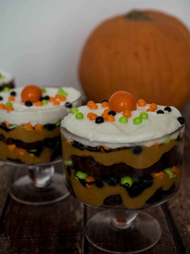 Chocolate Pumpkin Trifle - layers of chocolate brownies with pumpkin pudding all topped off with candy - a perfect Halloween dessert