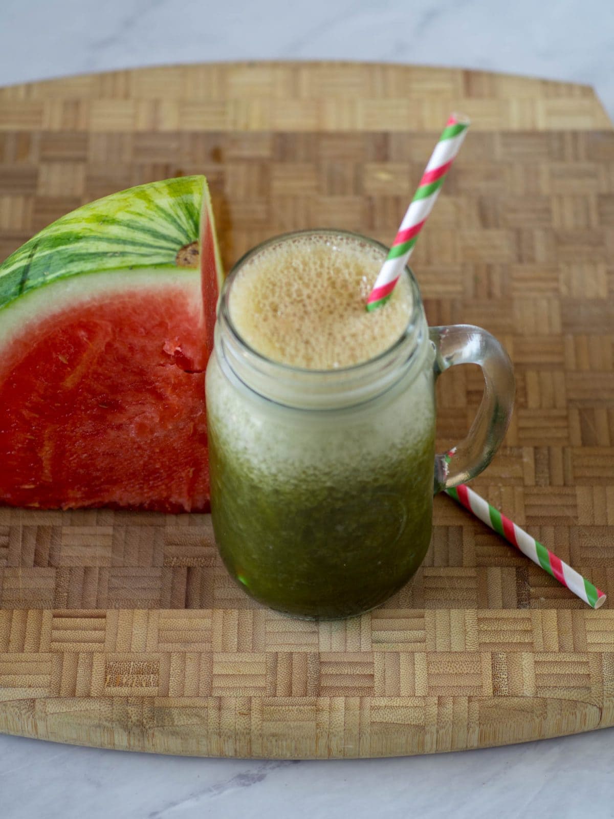 This tasty Kale Watermelon smoothie recipe is an easy summertime breakfast smoothie. This dairy free watermelon smoothie adds kale and banana for a creamy treat. #smoothie #kale #watermelon #healthy #dairyfree