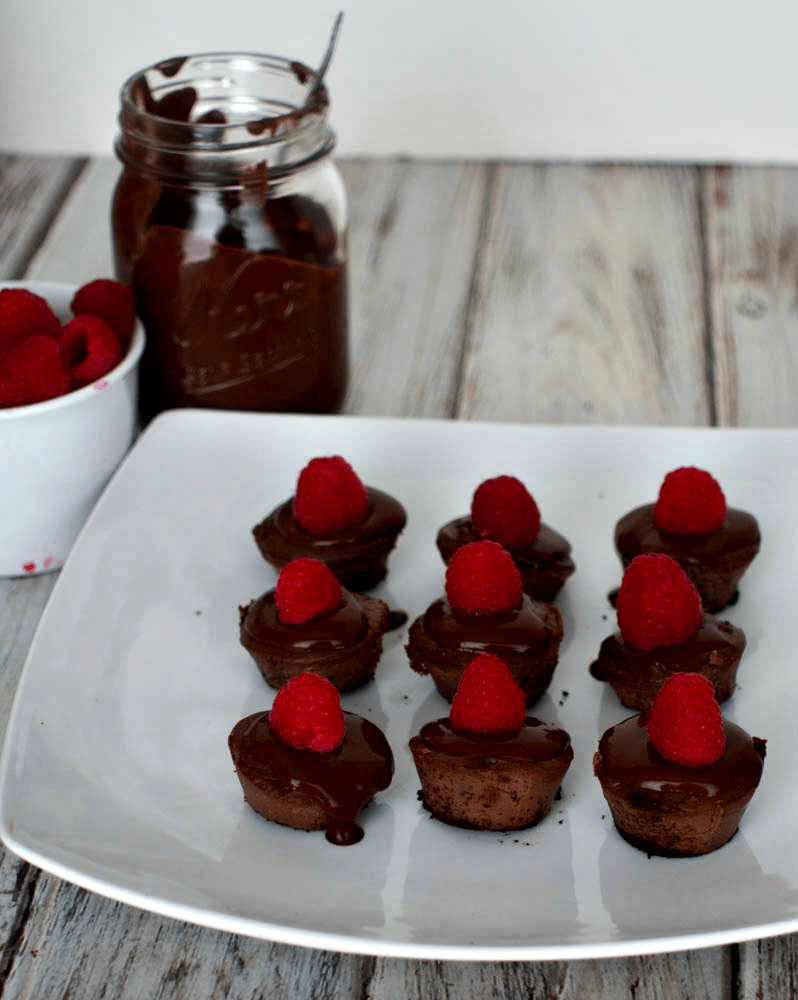 Mini Chocolate Cheesecake -These tasty bite size chocolate cheesecakes are made with Splenda and covered with sugar free chocolate sauce and raspberries.