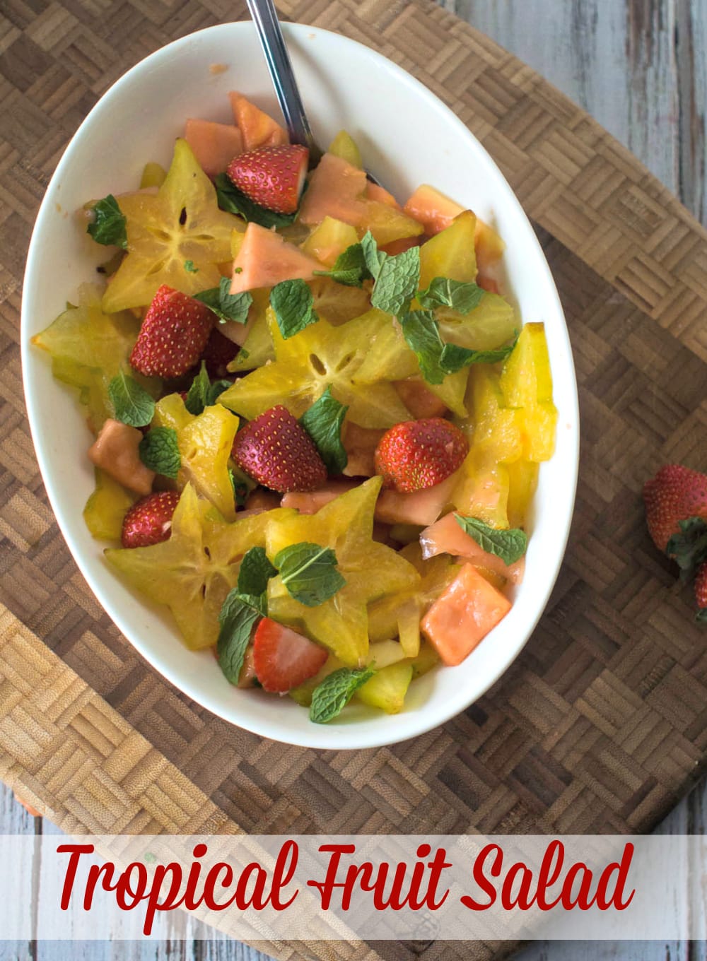 Tropical Fruit Salad - Starfruit, papaya and strawberries drizzled with lime and mint leaves