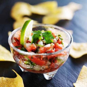 pico de gallo salsa with lime wedge and tortilla chips
