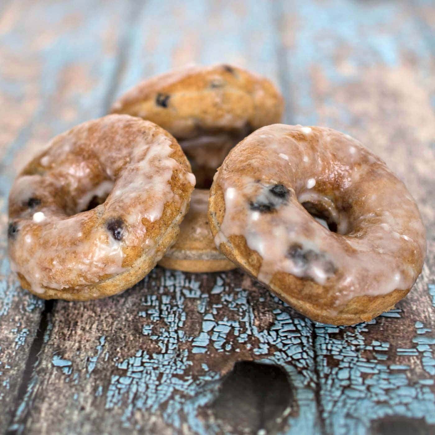 Chai Raisin Donuts with Chai Glaze - sweetly spiced donuts perfect for enjoying with Chai tea.