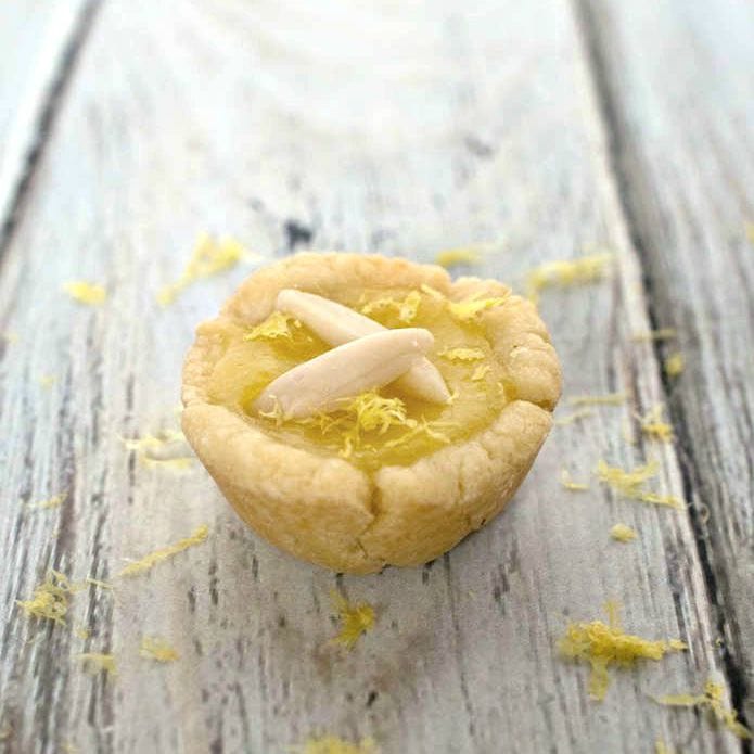 Lemon Tassies - bite sized tarts filled with tangy lemon curd - a perfect mini dessert