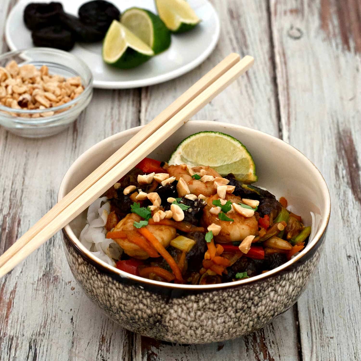 Thai Shrimp Noodle Bowl - a quck and easy family dinner featuring carrots, zucchini, red peppers, California Dried Plums, and shrimp in a teriyaki sauce. 