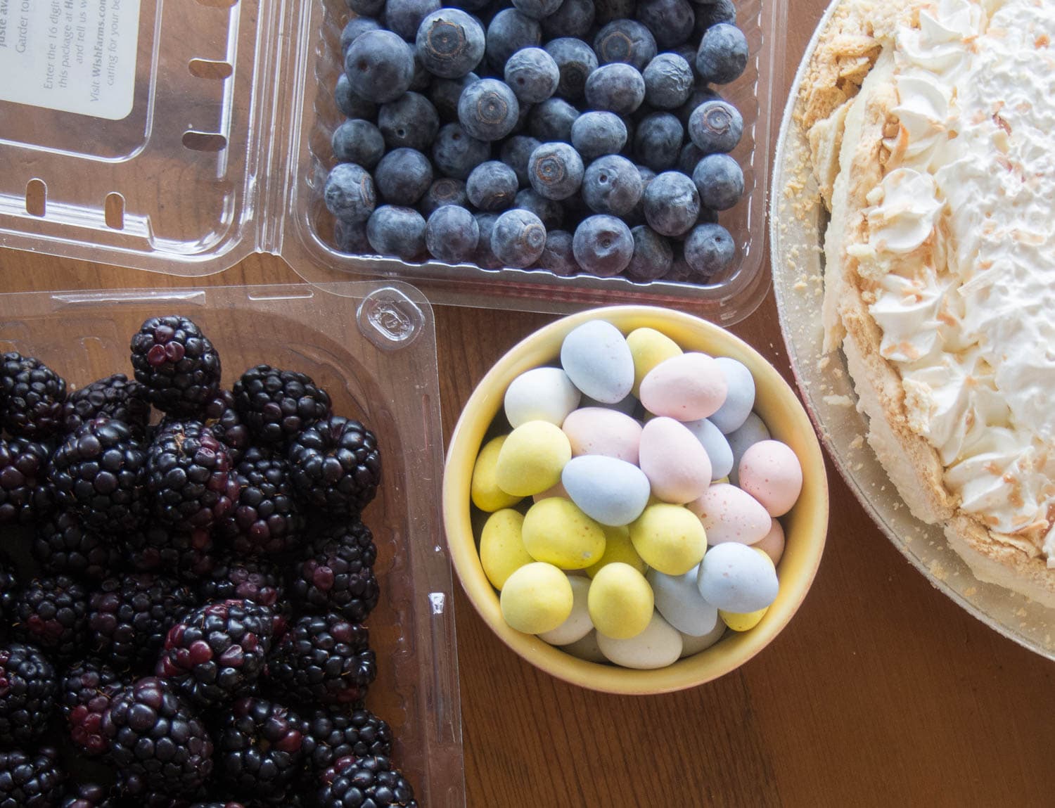 Make an easy Spring dessert by decorating a Coconut Cream Pie with fresh fruit and chocolate eggs.
