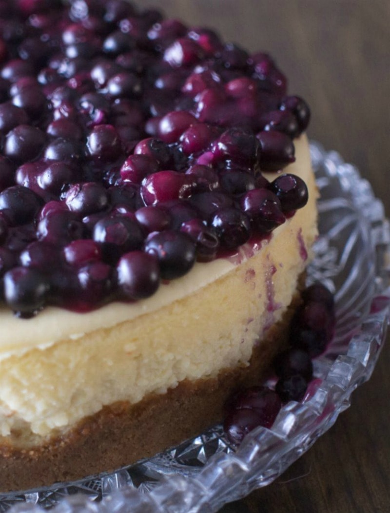 This Blueberry Cheesecake recipe is an easy dessert. This simple cheesecake with berries is perfect for a holiday dessert or thanksgiving dessert. New York Cheesecake #dessert #cheesecake #blueberry