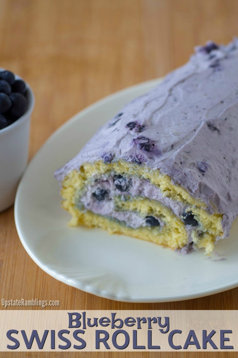 This Blueberry Swiss Roll Cake combines a springy sponge cake rolled up with whipped cream and blueberries. The easy dessert is a delicious way to use blueberries and makes a pretty homemade dessert for the holidays. #dessert #blueberries #swissrollcake #holidaybaking