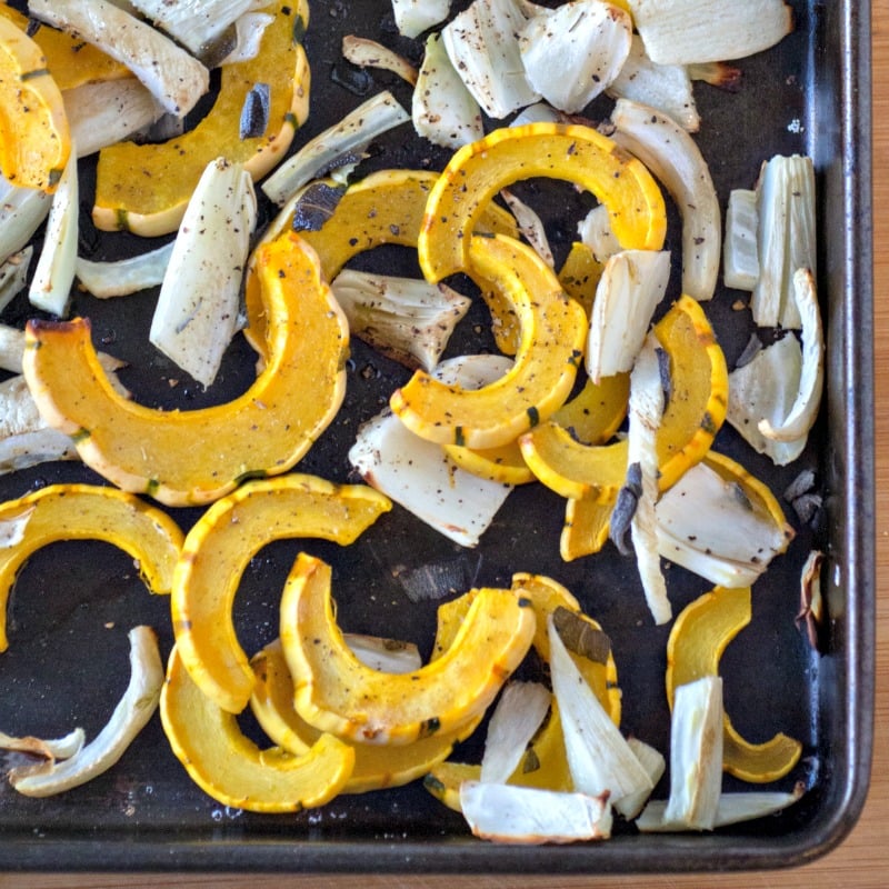 Close up of Delicata squash roasted in the oven with fennel
