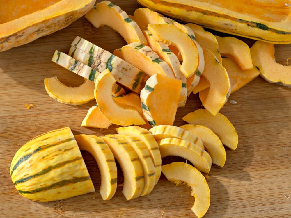 Slicing the delicata squash into rings for roasting