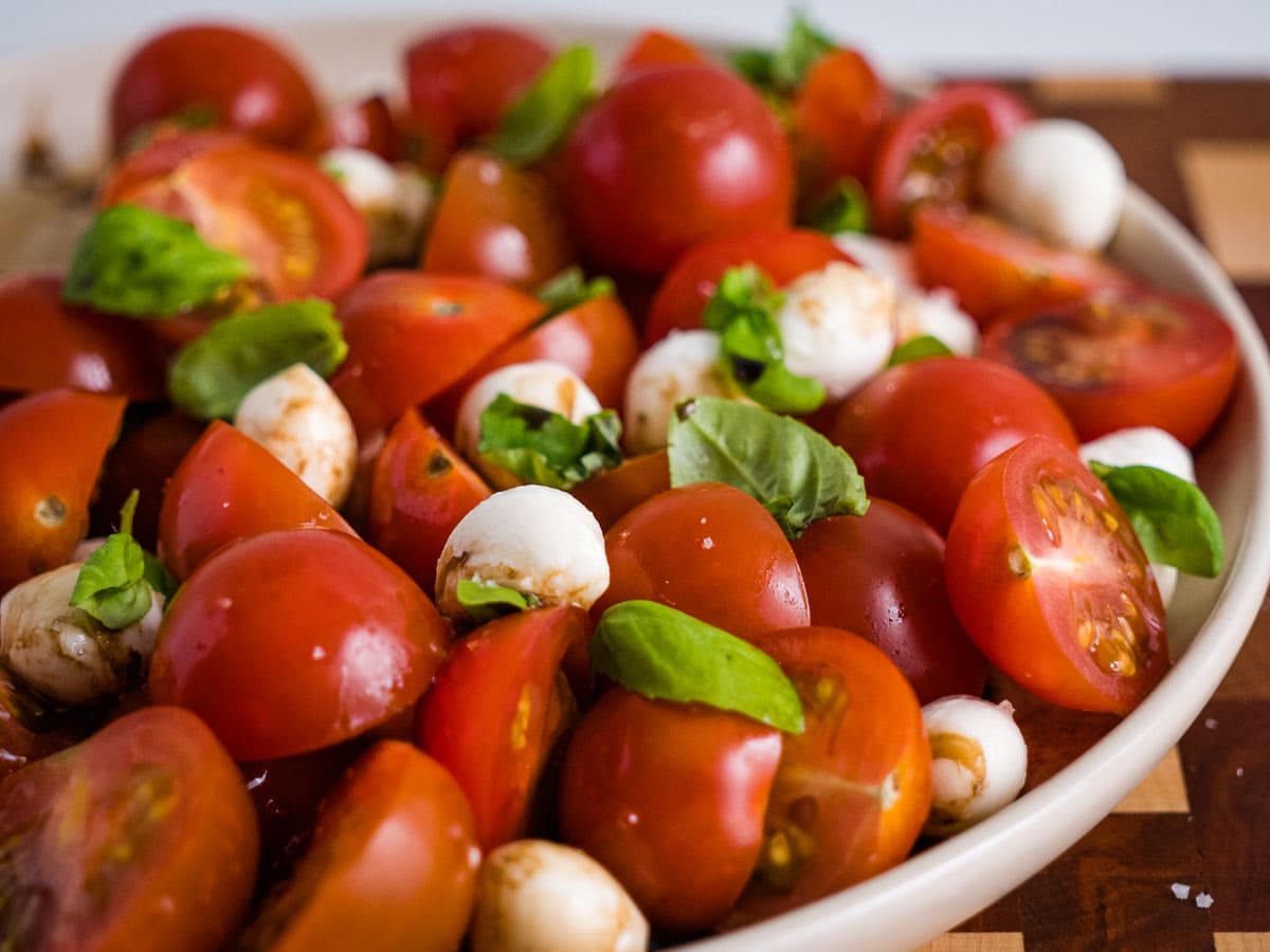 caprese salad with cherry tomatoes and mozzarella pearls.
