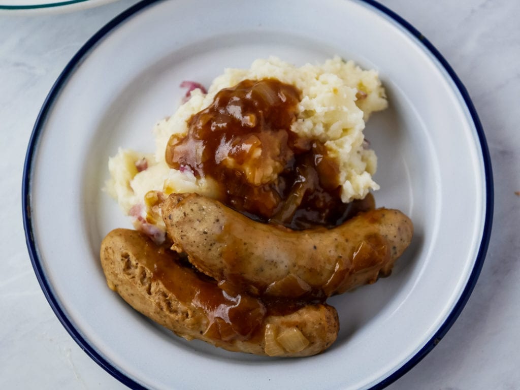 top view of bangers and mash on a plate