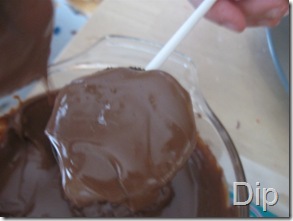 Dipping Oreos in melted chocolate