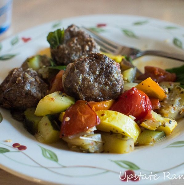 Meatballs and veggies on a plate.
