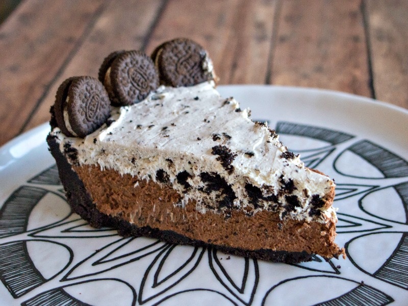 Chocolate pie with cookies and cream layer topped with mini oreos.