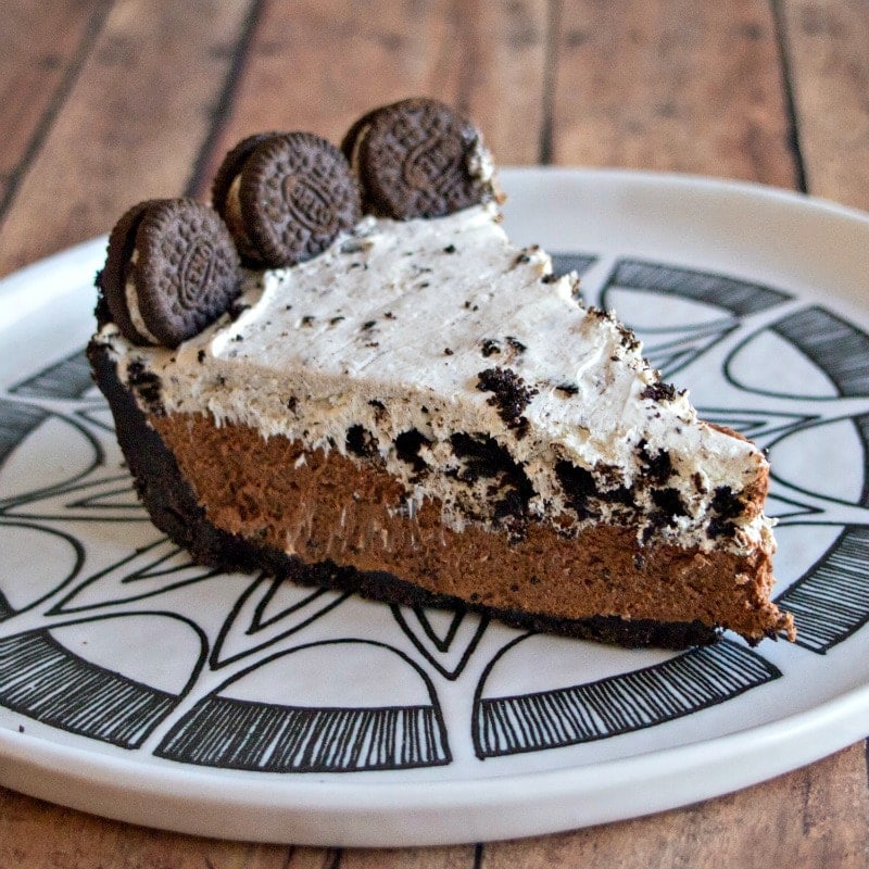 A slice of chocolate Oreo pie on a plate.
