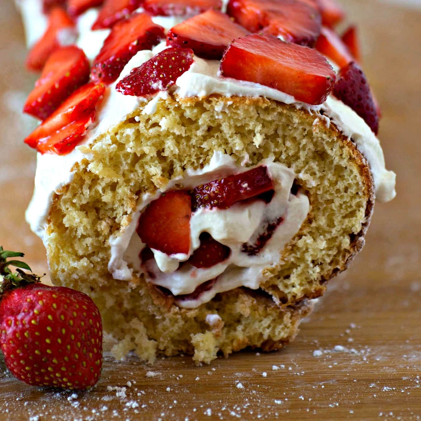 A slice of strawberry roll cake.