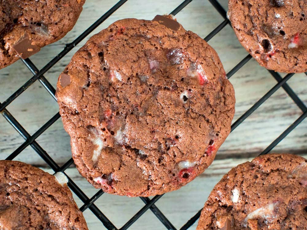 Cranberry chocolate chip cookies on a cooling rack.