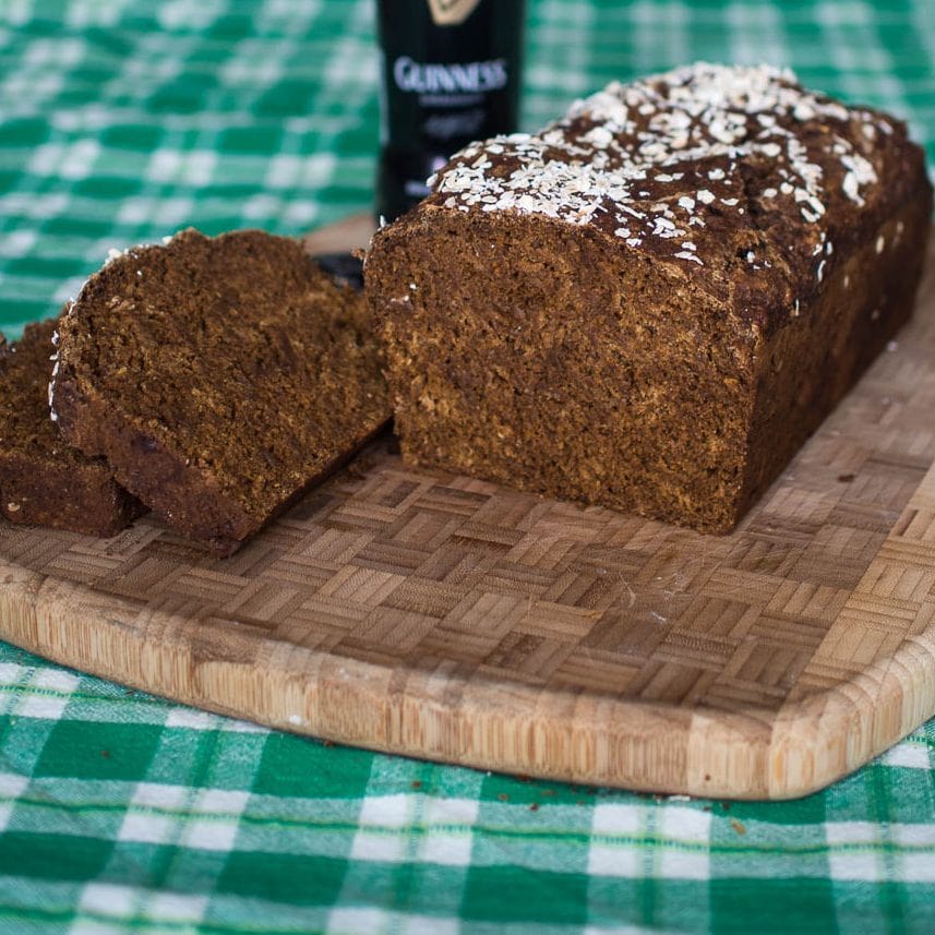 Sliced Guinness bread on a cutting board.