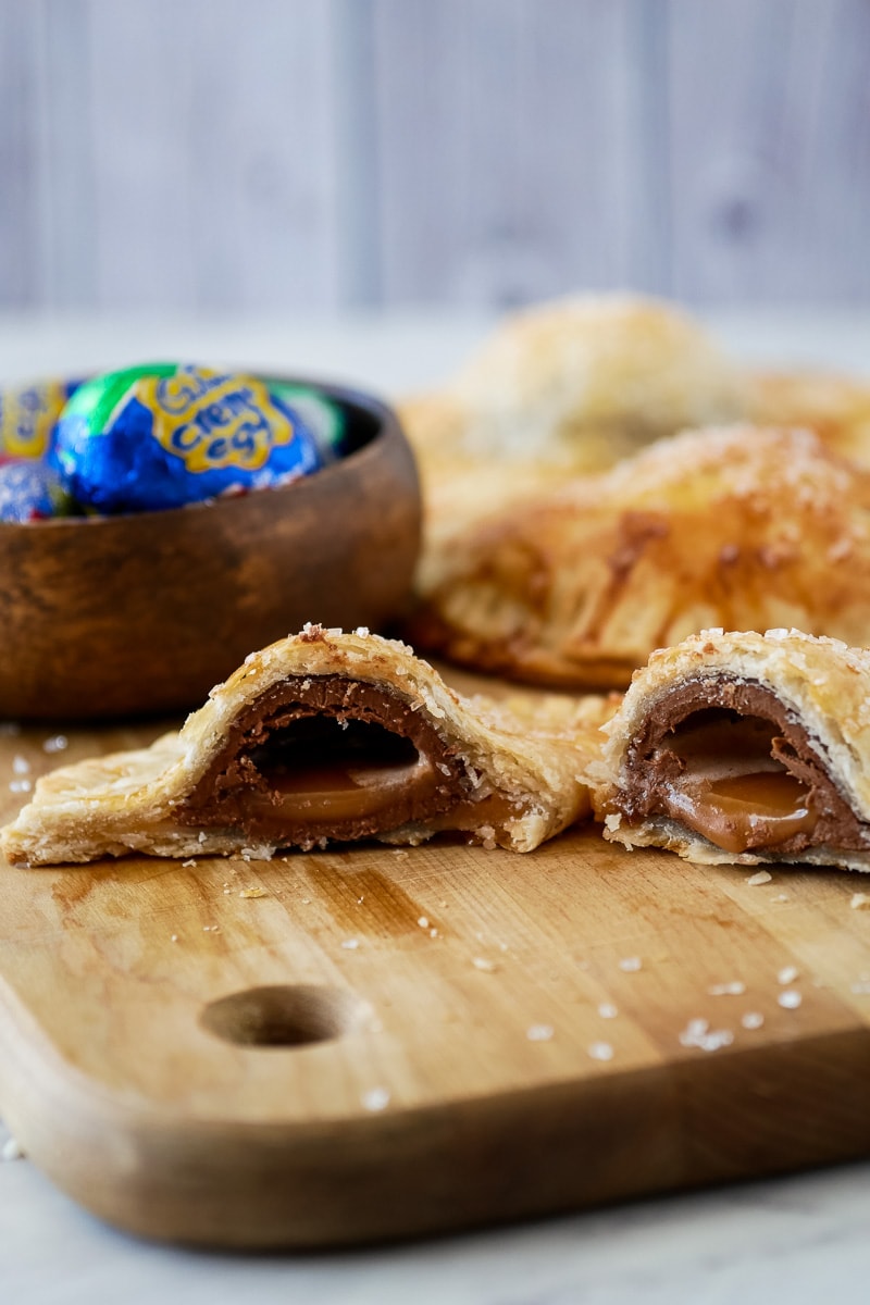 Make a fun Cadbury Creme Egg dessert by baking the chocolate eggs into a hand pie for a quick and easy Easter dessert. An unexpected chocolate Easter treat with a combination of flaky pie crust and gooey filling that you need to try to appreciate! #easterdessert #cadburycremeegg