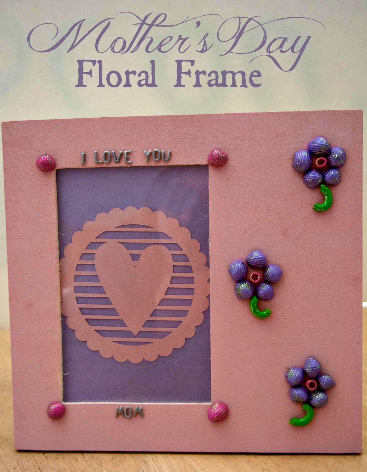 This Mother's Day Floral Frame makes a wonderful and inexpensive gift for your mom this year!  Decorate a wooden frame with pasta from your pantry.