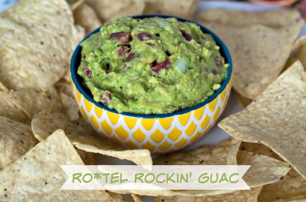 A bowl of Rockin' Guac with chips and tortillas.