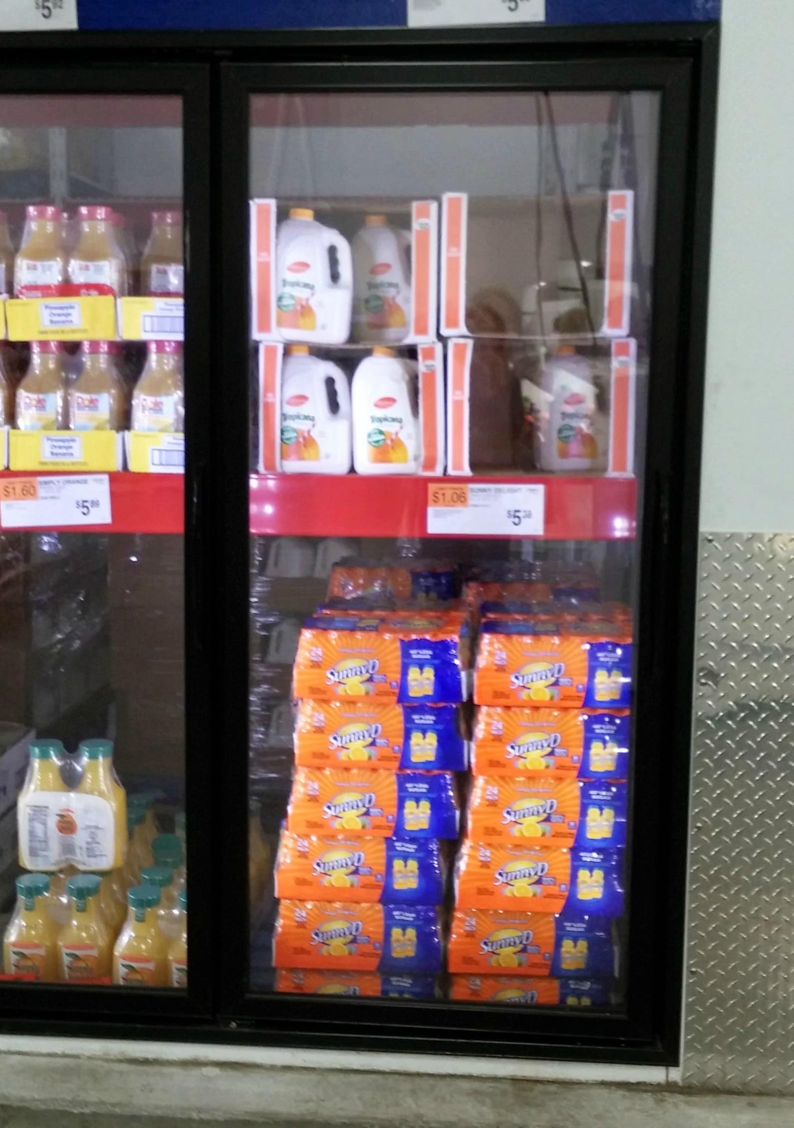 A refrigerator stocked with ample food.