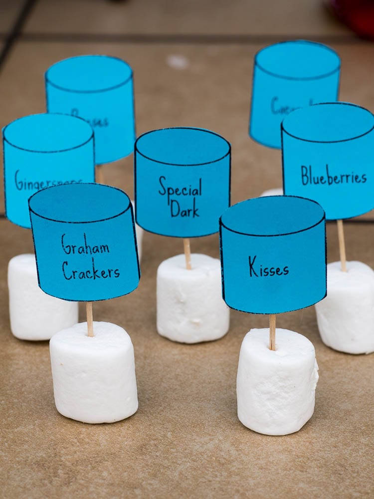 A group of marshmallows with blue labels on them.