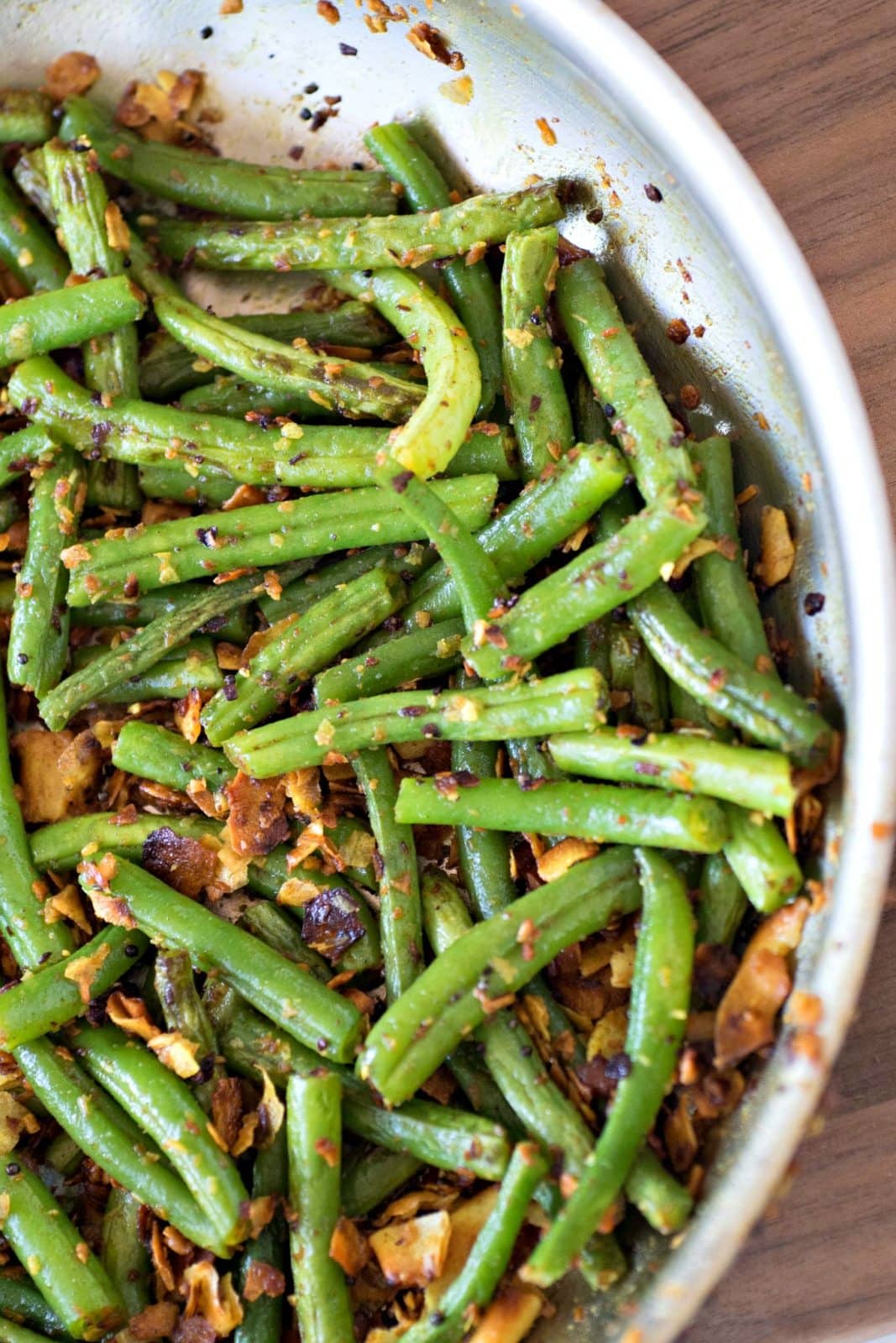 Sauteed green beans on a table.