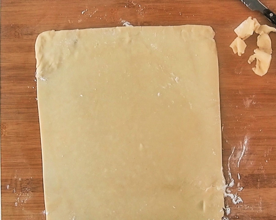 cutting the dough into a square shape