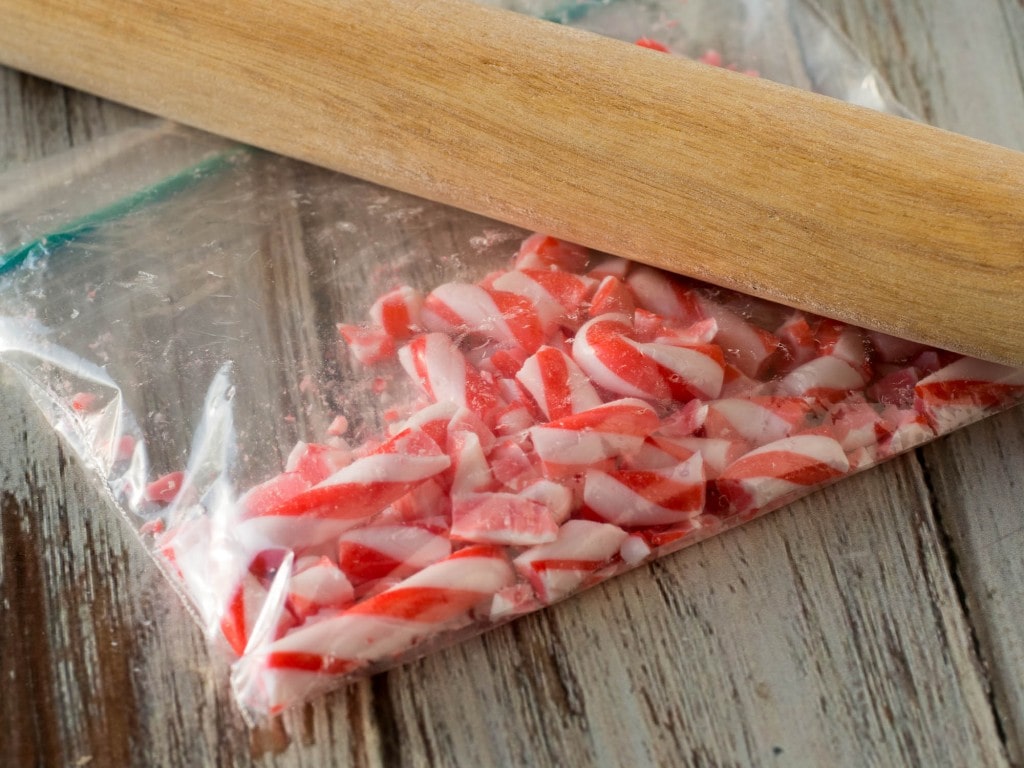 crushing candy canes with a rolling pin