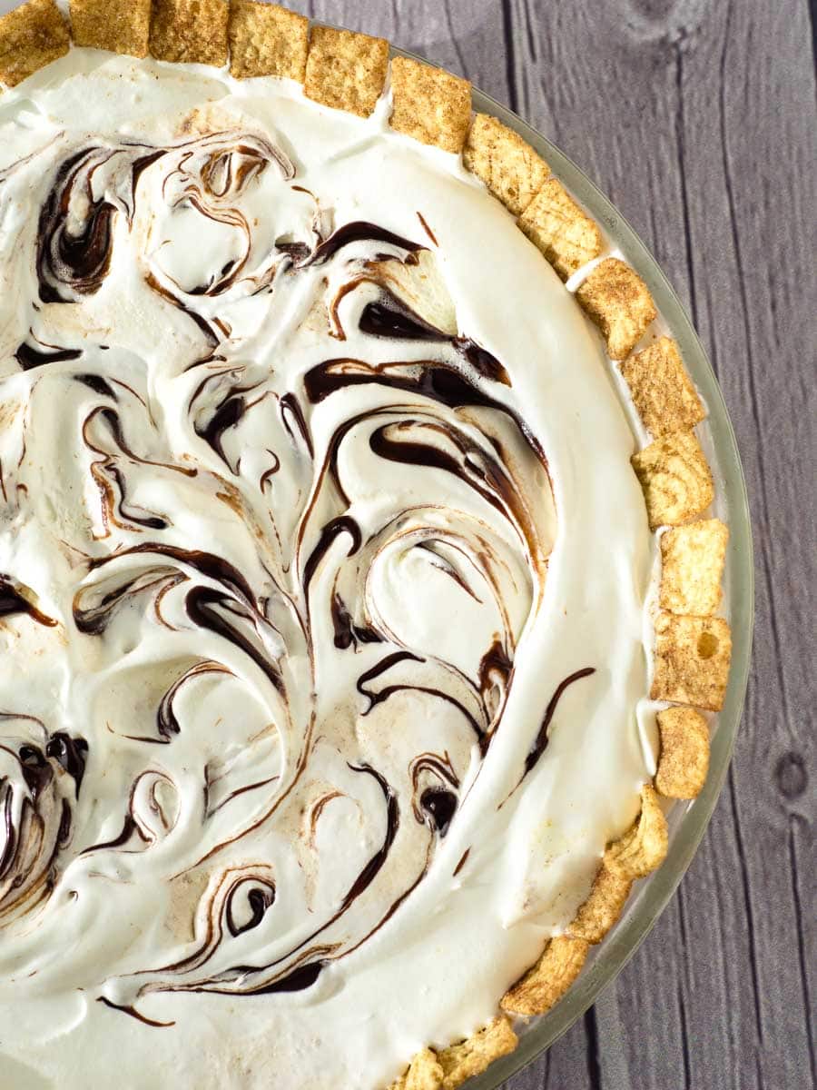 top view of ice cream pie with swirls of hot fudge.