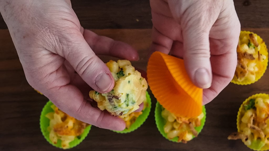 popping the mac and cheese bites out of the muffin cups