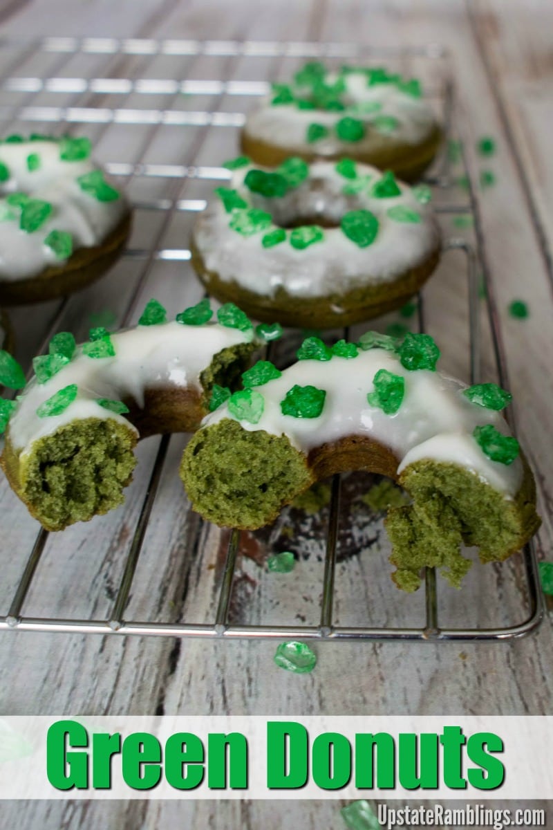 Green donuts on a cooling rack for St Patrick's Day.