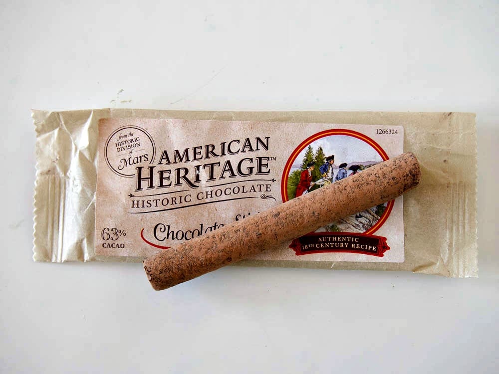 An American heritage chocolate bar on a white surface.
