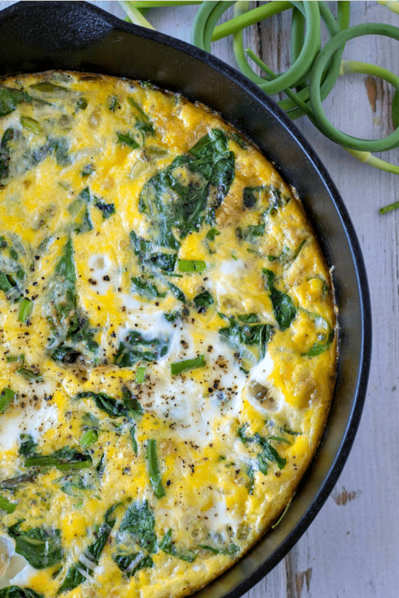 Breakfast Frittata made with spinach and garlic scapes