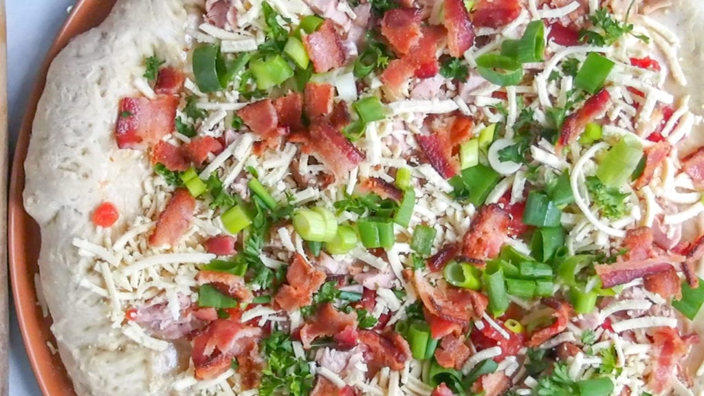 closeup of pizza before cooking