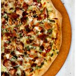 chicken bacon ranch pizza on a pizza peel