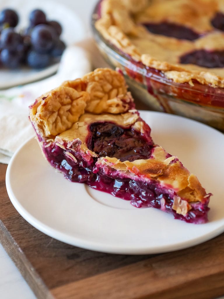 Concord grape pie on a plate