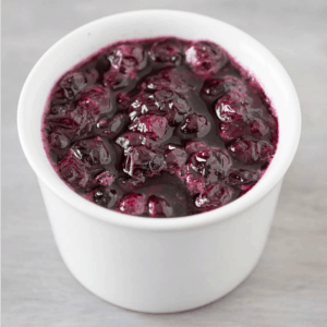 homemade blueberry sauce in a white bowl