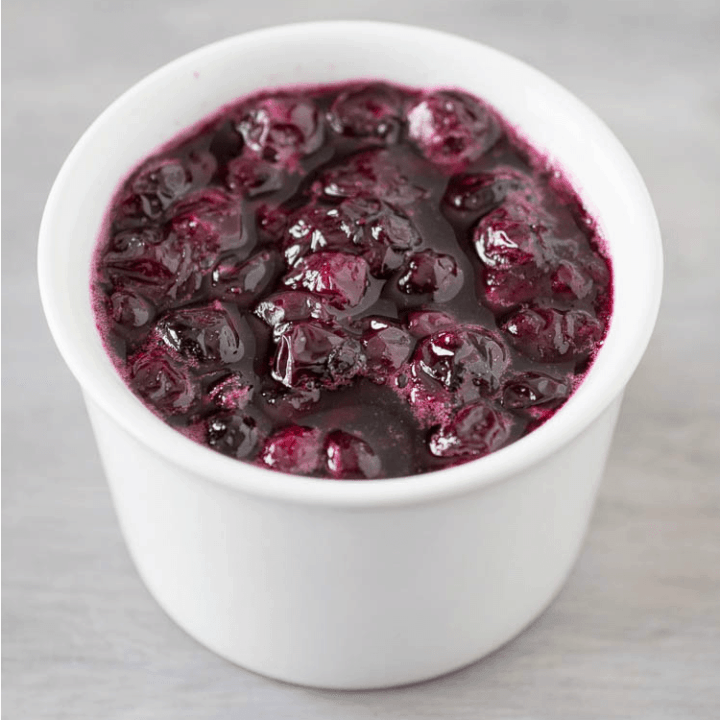homemade blueberry sauce in a white bowl