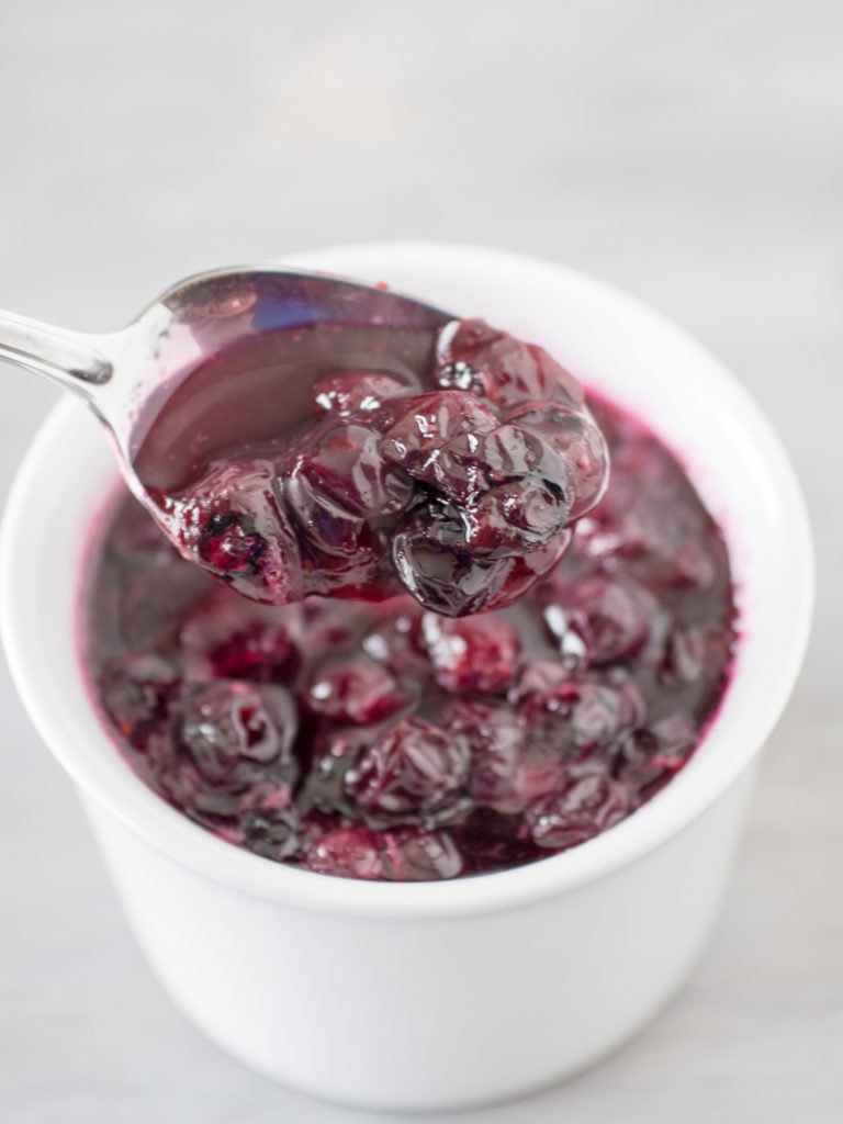 blueberry sauce on a spoon