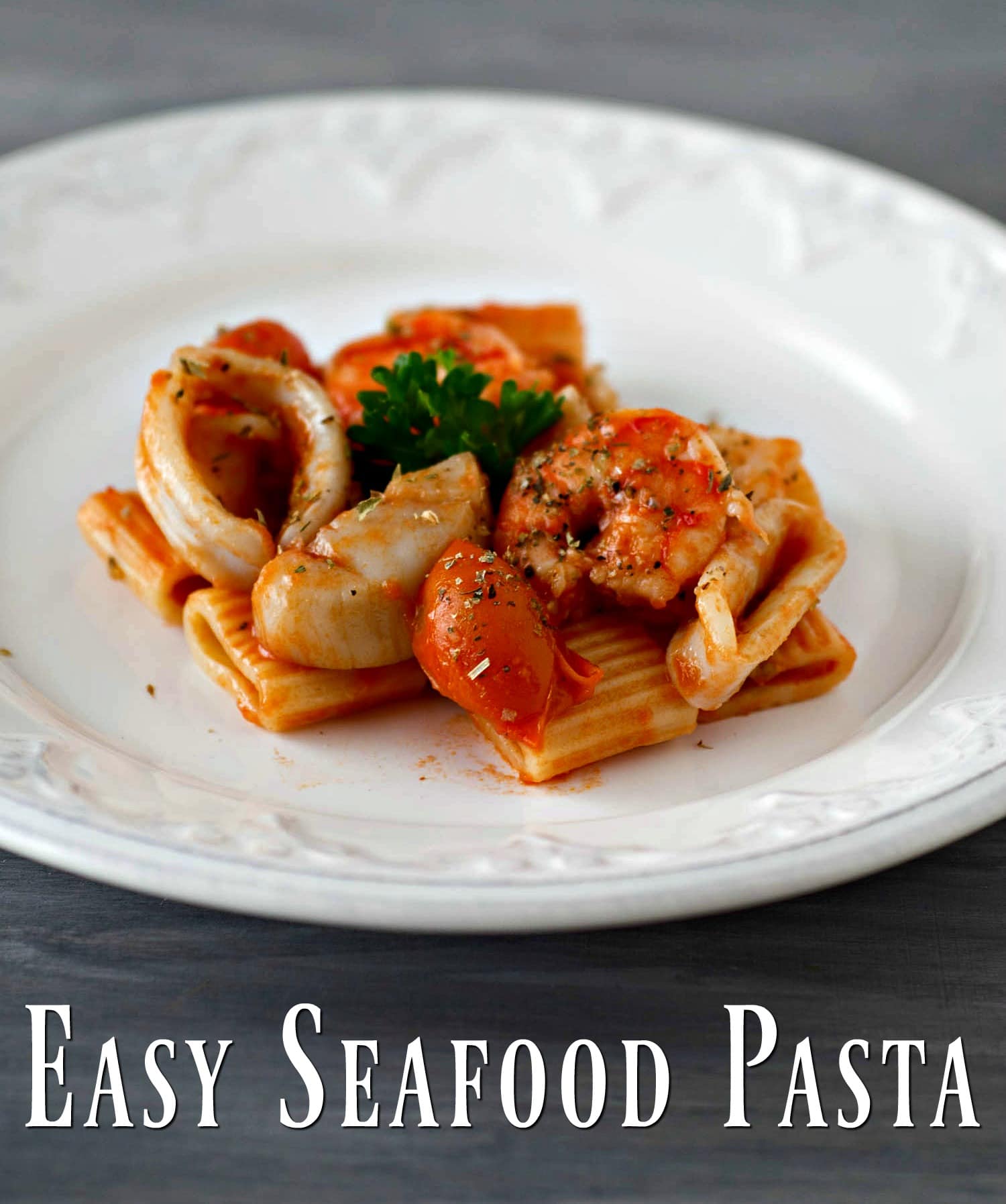 Easy seafood pasta on a white plate.