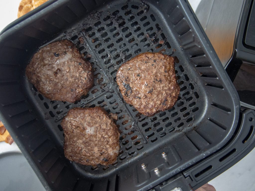 burgers cooking in air fryer