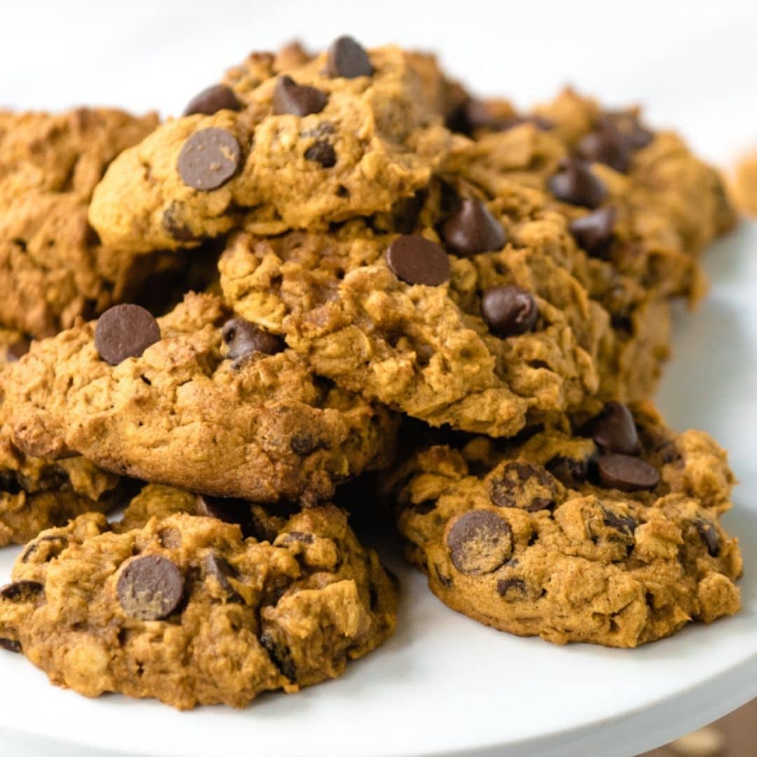 Pumpkin chocolate chip cookies on a plate.