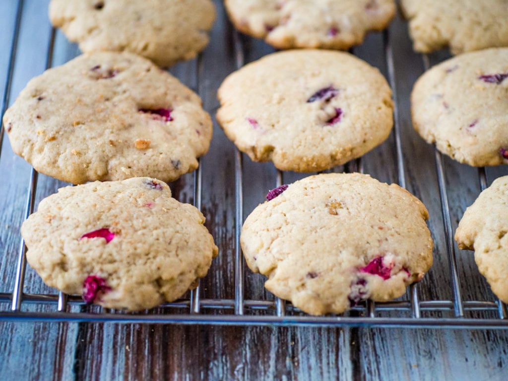 cranberry walnut cookies on a baking rack