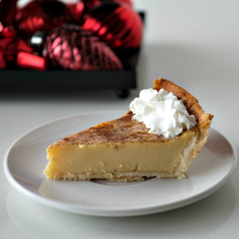 Slice of eggnog pie on a plate.