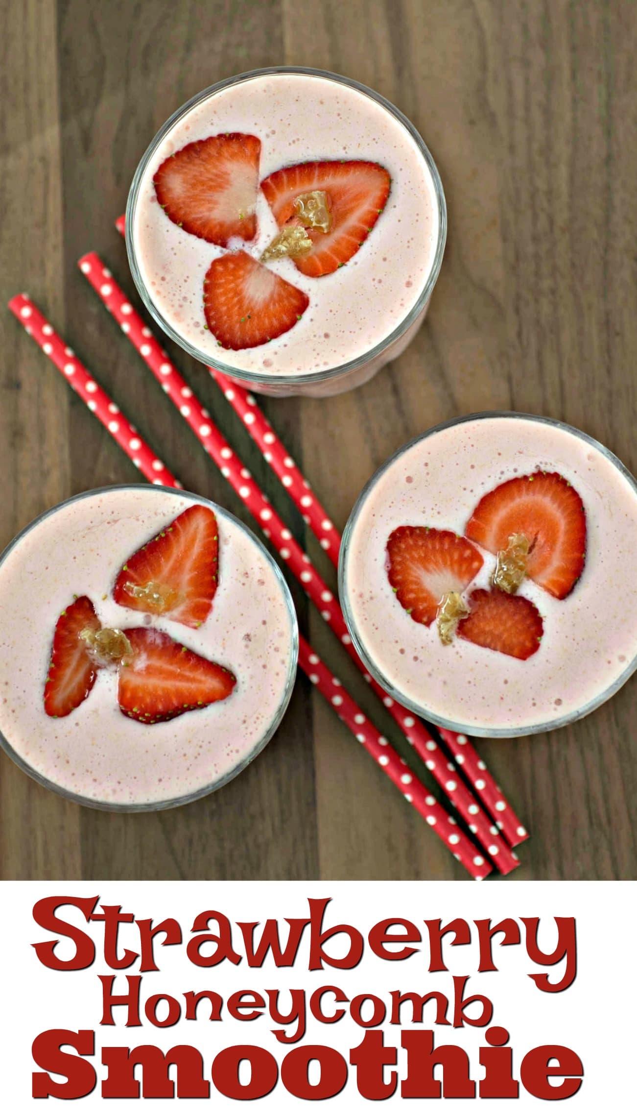 Strawberry honeycomb smoothie with strawberries and straws.