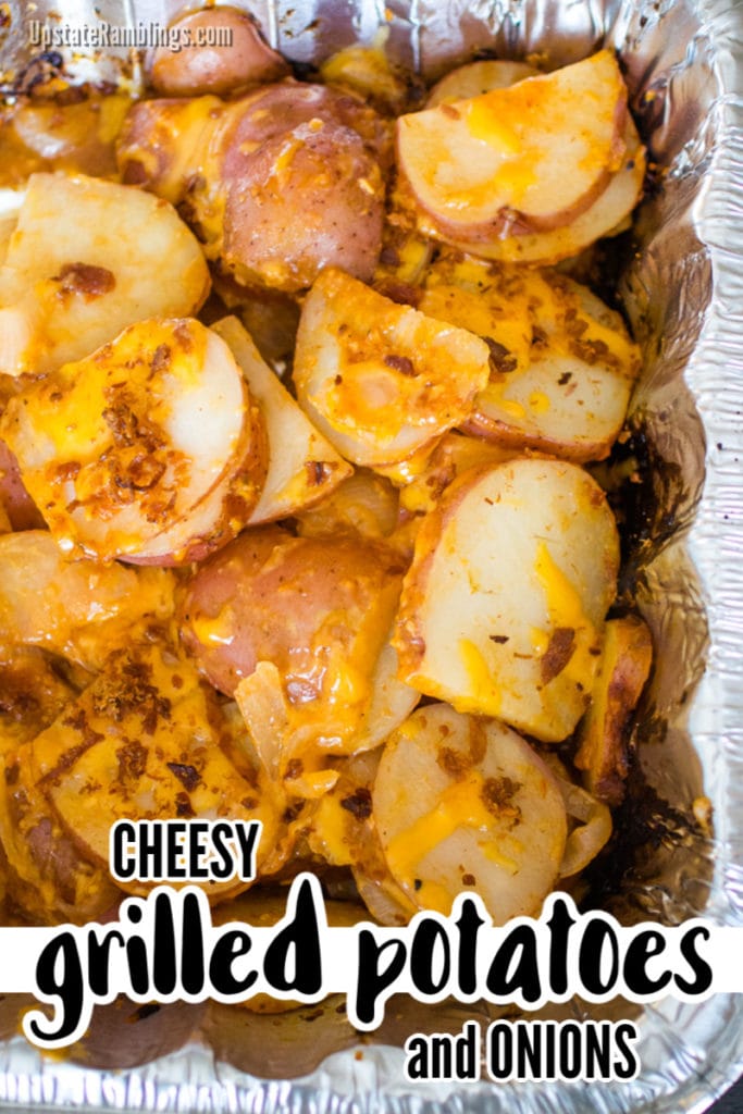 pan of cheesy grilled potatoes with onions after cooking